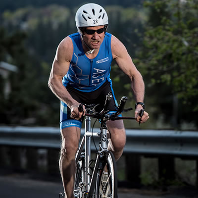 ASEA Athlete, Shawn Burke, Elite Triathlete - shown riding his racing bike
